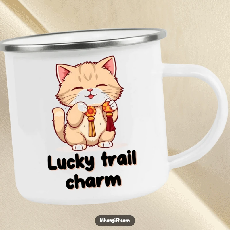 Funny cat camping mug featuring a fluffy cat in a playful crouch batting at a dangling lucky charm.