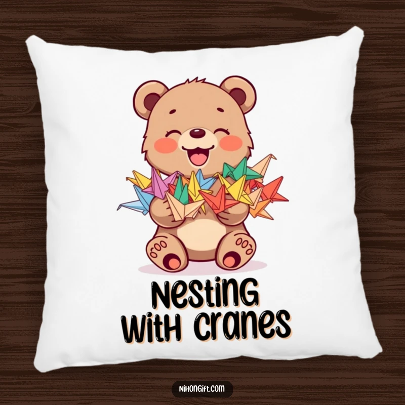 Funny pillow featuring a joyful bear cub holding a stack of colorful origami cranes, offering cozy humor.