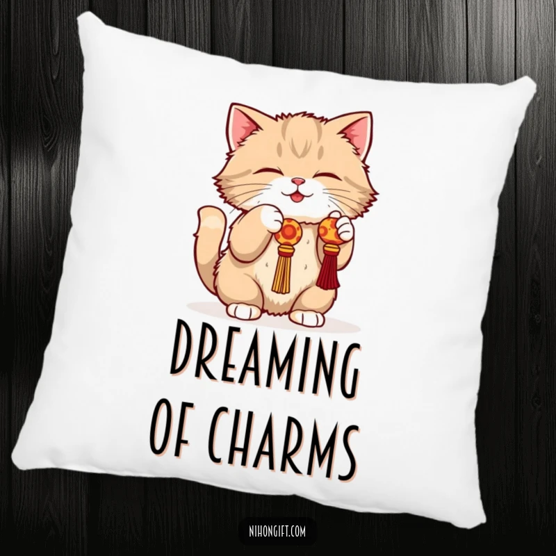 Funny cat pillow showing a fluffy cat in a playful crouch batting at a dangling lucky charm.