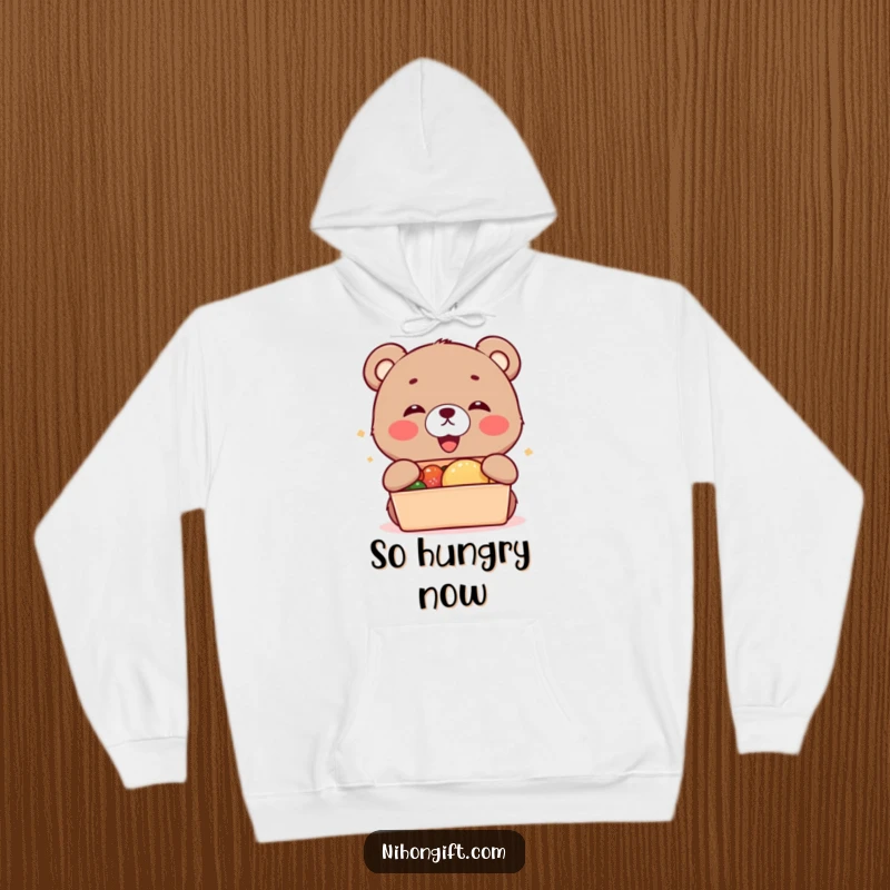 Funny kawaii bear cub cub accepting a bento box, featured on a warm hoodie.