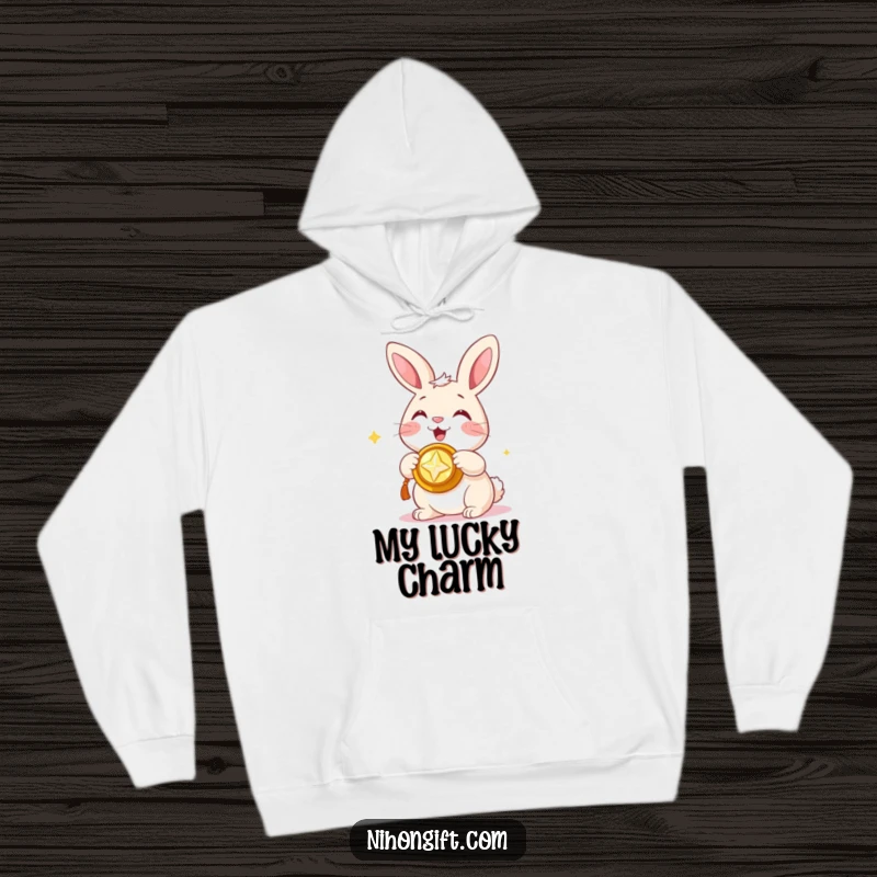 Funny hoodie featuring a happy bunny presenting a shiny trinket, offering comfort and humorous good luck.