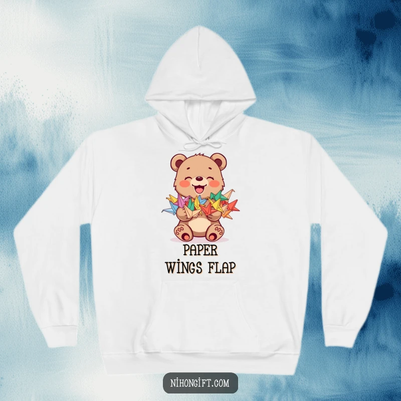 Funny hoodie featuring a joyful bear cub holding a stack of colorful origami cranes, offering comfort and humor.