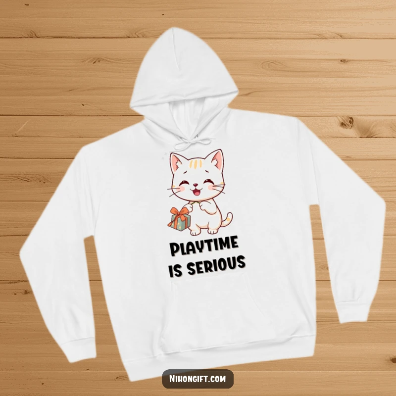 Funny smiling cat in a hoodie, happily dangling a string from a gift, embodying cozy mischief.
