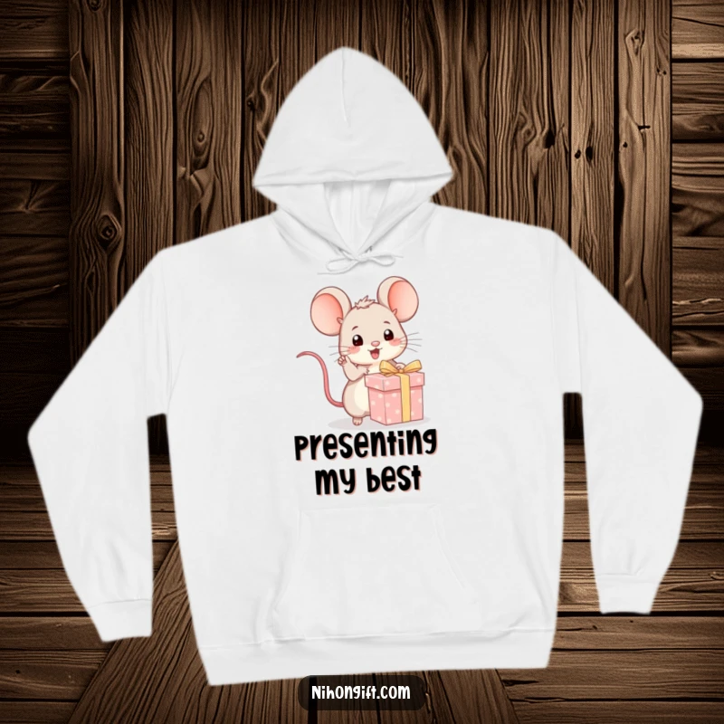 Funny kawaii mouse excitedly pointing at a wrapped gift on a cozy hoodie for playful comfort and anticipation.