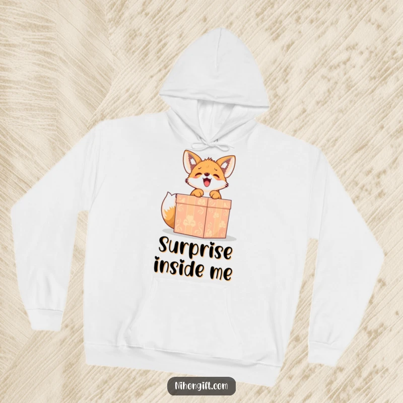 Funny cute fox puppy gleefully unwrapping a large, ornate gift box on a hoodie, ideal for cozy giggles.