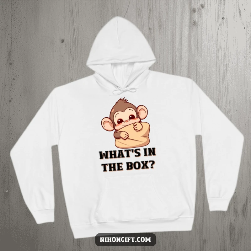Comfortable hoodie with a mischievous monkey peeking from behind a large, wrapped item, perfect for cozy mischief.