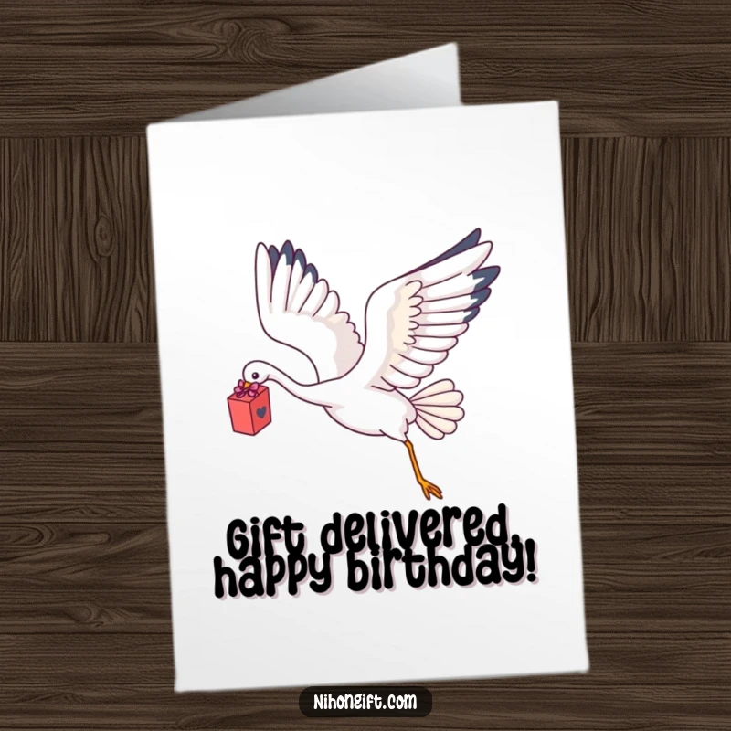 Charming Free Printable Birthday Card: A kawaii crane gracefully flying with a delicate gift box held gently in its talons.