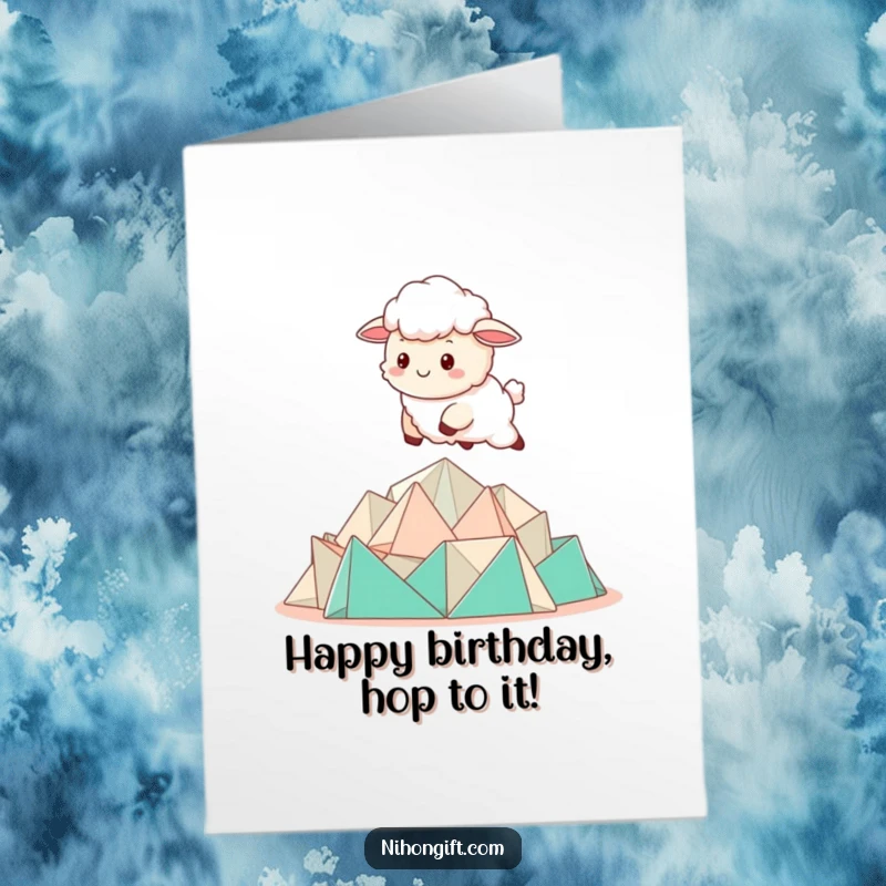 Cute Free Printable Birthday Card: A kawaii sheep joyfully bounding over a neat pile of colorful folded origami.