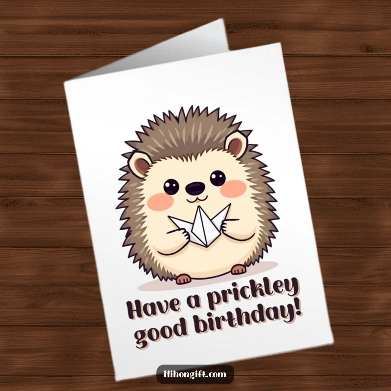 Funny Free Printable Birthday Card: A hedgehog proudly presents a tiny origami crane, offering artistic wishes.