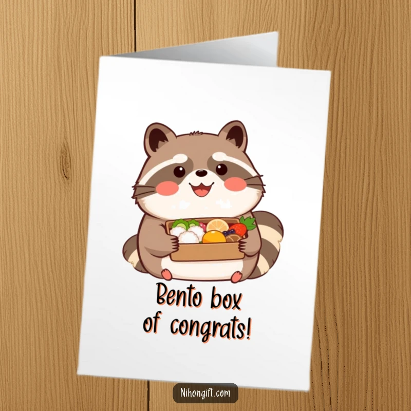 Funny Free Printable Congrats Card: Kawaii tanuki with happy expression, holding a beautifully presented bento box in celebration.
