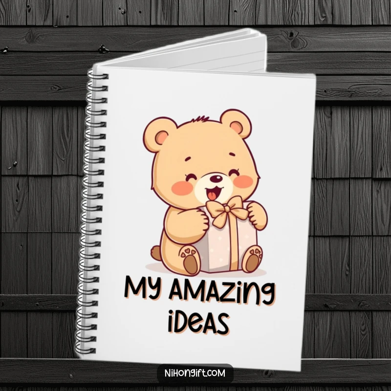 Funny bear notebook featuring a little bear enthusiastically opening a wrapped gift, perfect for journaling and humor.