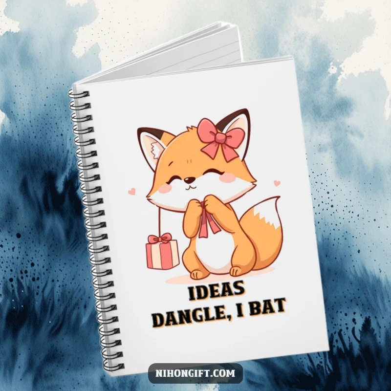 Funny Kawaii Fox Notebook depicting a cute fox playfully batting at a dangling gift ribbon, perfect for jotting down playful thoughts.