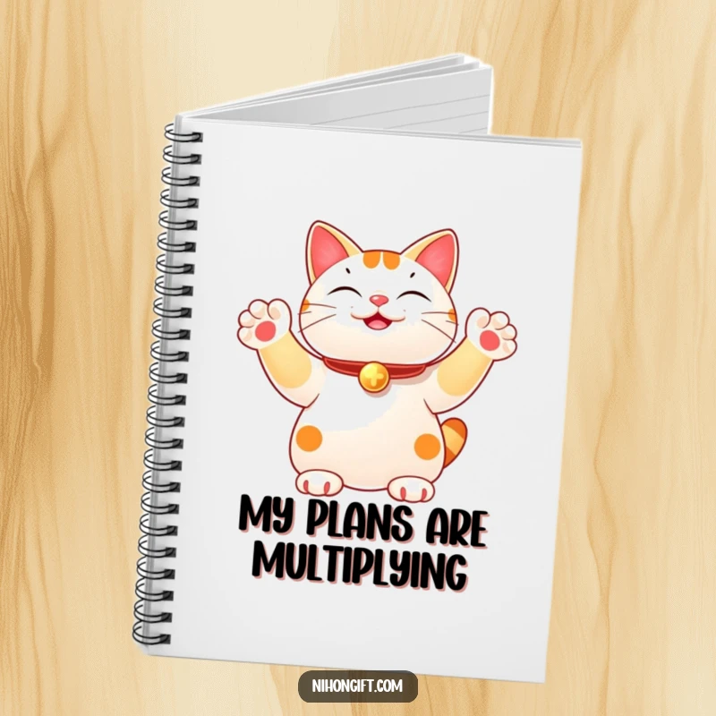 Funny notebook featuring a lucky cat joyfully waving multiple paws, perfect for jotting down notes and lucky thoughts. A whimsical stationery item.