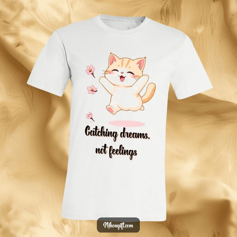 Funny T-shirt depicting a fluffy cat mid-leap, enthusiastically chasing a floating cherry blossom petal in a moment of pure bliss.