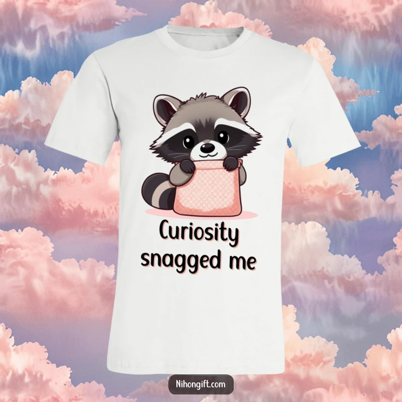 Funny Kawaii Raccoon T-Shirt showing a cute raccoon peering curiously into a shimmering gift bag, full of playful investigation.