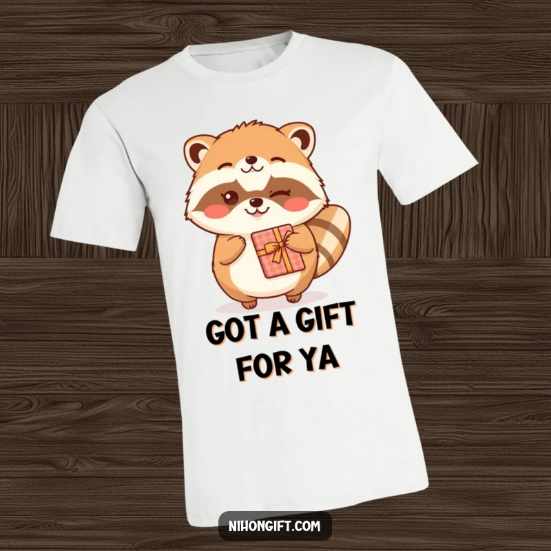 Funny kawaii tanuki character winking and offering a wrapped gift on a T-shirt, celebrating friendship.