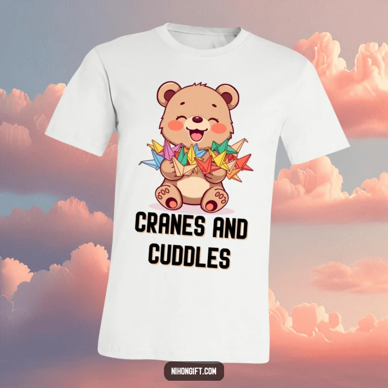 Funny t-shirt with a joyful bear cub holding a stack of colorful origami cranes, representing happiness and creativity.